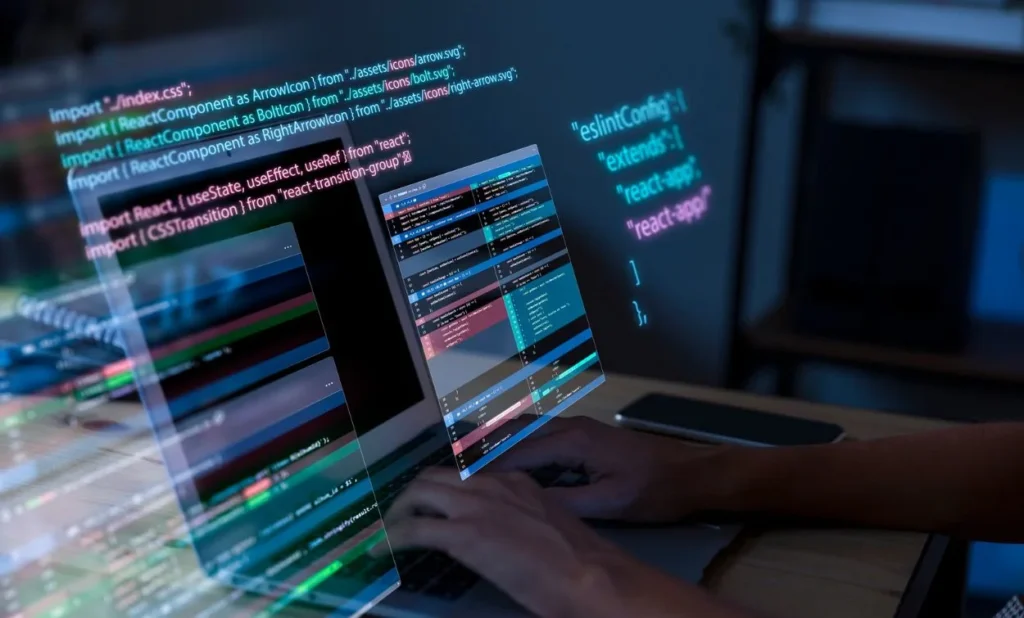 A person typing on a laptop with multiple holographic code windows floating above the screen, displaying JavaScript and React code in a dark workspace.