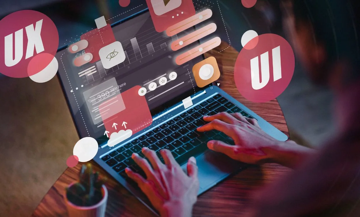 A person typing on a laptop with floating UX and UI design icons and interface elements around the screen.
