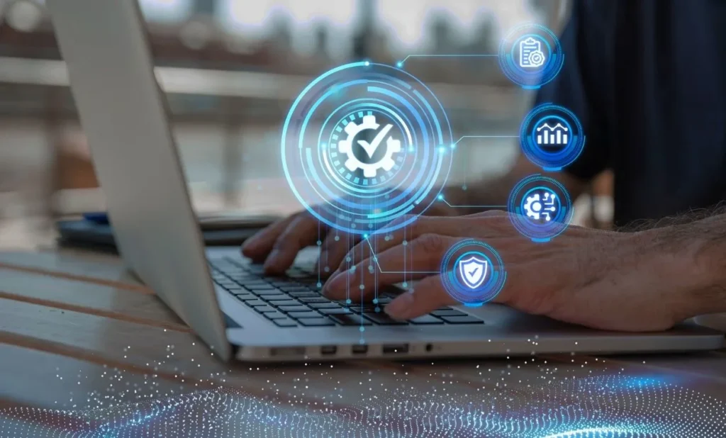 Professional working on a laptop with digital cloud computing and software testing technology icons displayed on the screen.